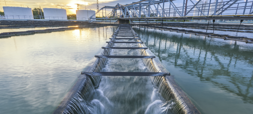 Image of a modern water treatment facility with cascading water in filtration systems, reflecting advanced purification technology and sustainable water management." These elements are optimized for search engines and align with the image's focus on water treatment and sustainability